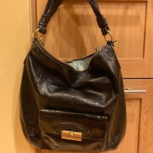 Black patent leather Coach shoulder bag.